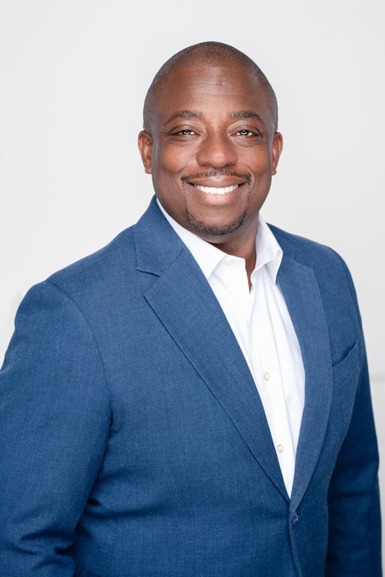 A professional portrait of  Brian Benjamin